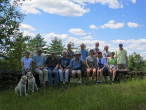 The group sitting on the long stone bench.