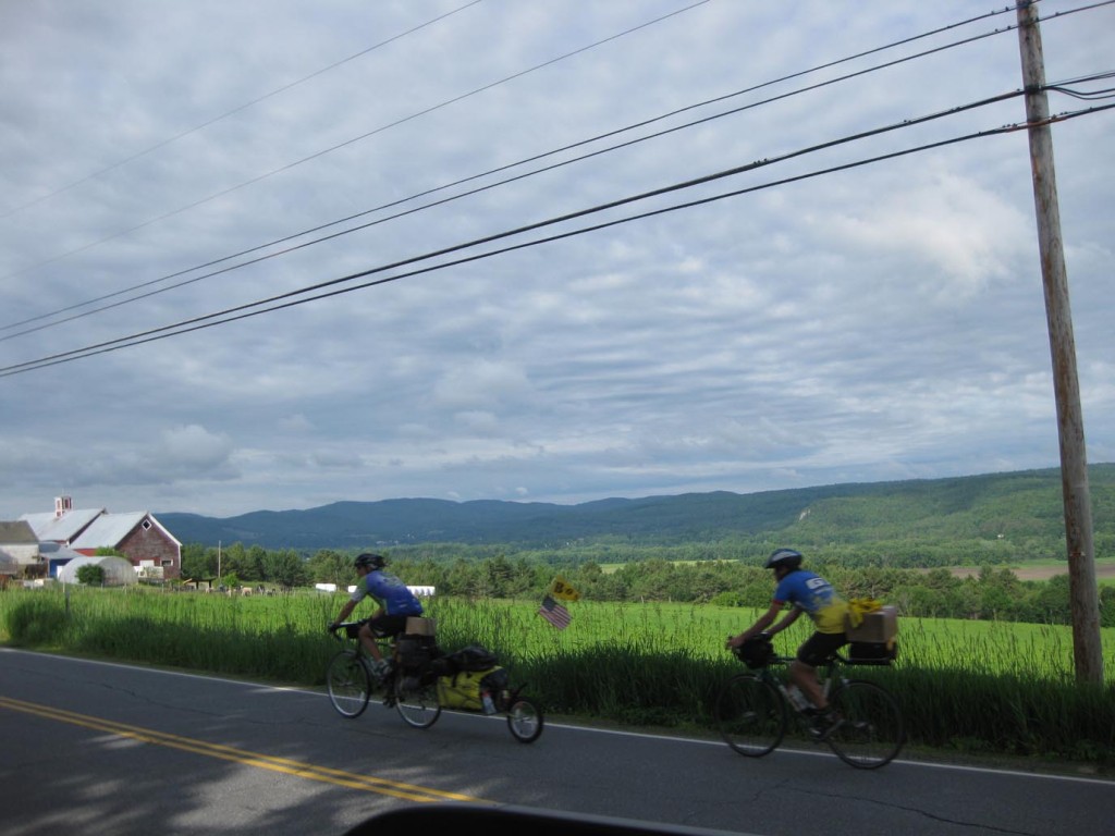 Cyclists on Route 10 in Piermont, NH overlook UVLT conserved Winsome Farm and half a dozen other visible protected properties along the Connecticut River valley.  This view is along the 77-mile Prouty route this year. 
