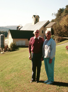 Louis and Peggy Maxfield in front of the Lemax Barn in 1996, when the farm was conserved.